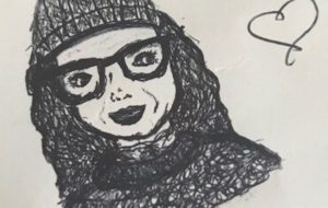 My daughter drew this picture of me. I am wearing a beanie and a jumper that my mum knitted.